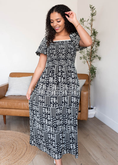 Short sleeve black printed smocked dress