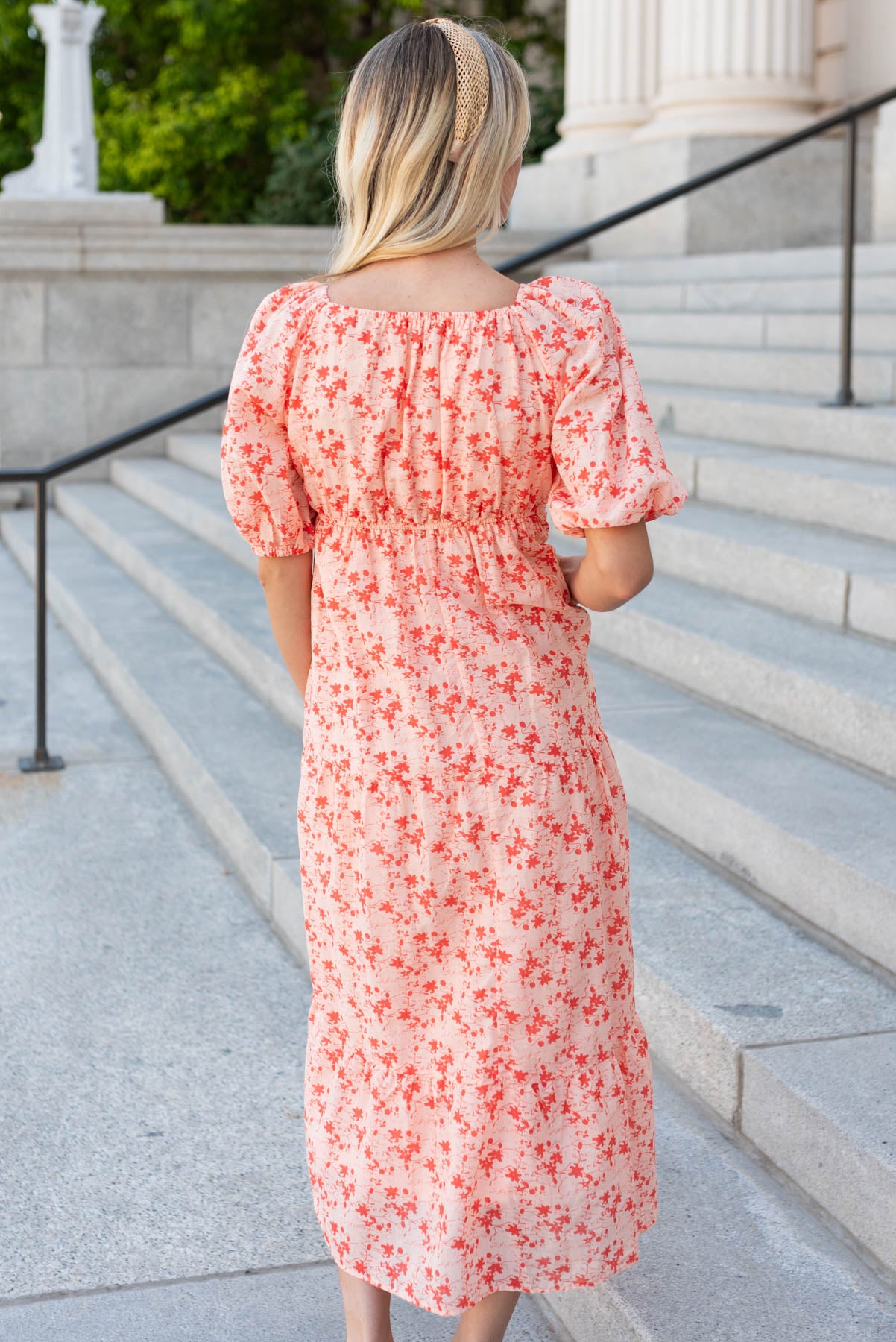 Back view of the peach floral tiered dress