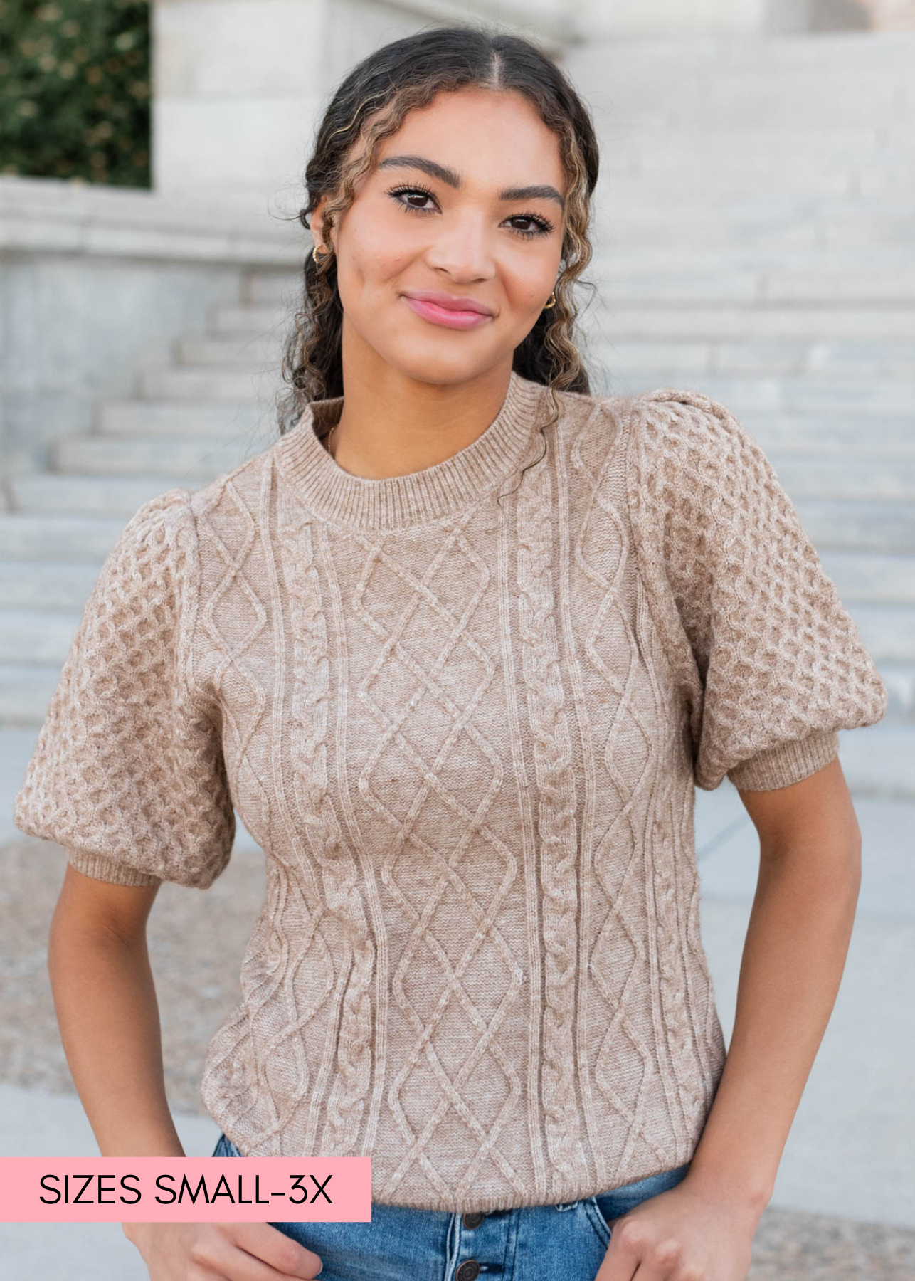 Close up of the sweater pattern on the taupe short sleeve sweater