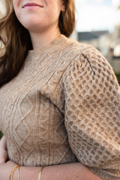 Close up of the knit pattern on the plus size taupe short sleeve sweater