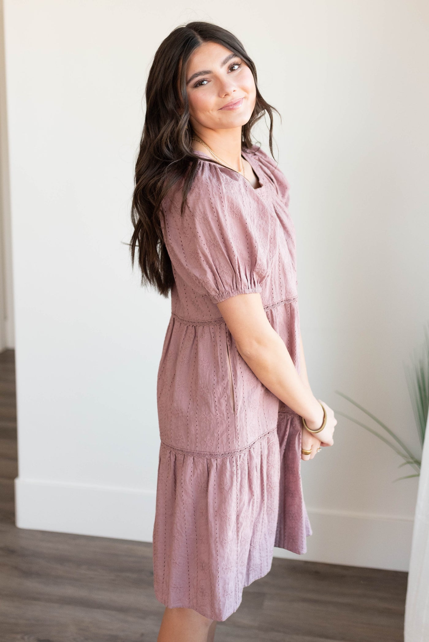 Side view of the mauve embroidered dress