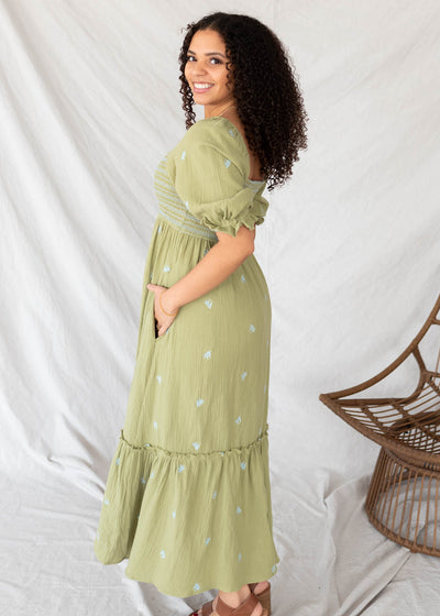 Side view of the green floral embroidered dress