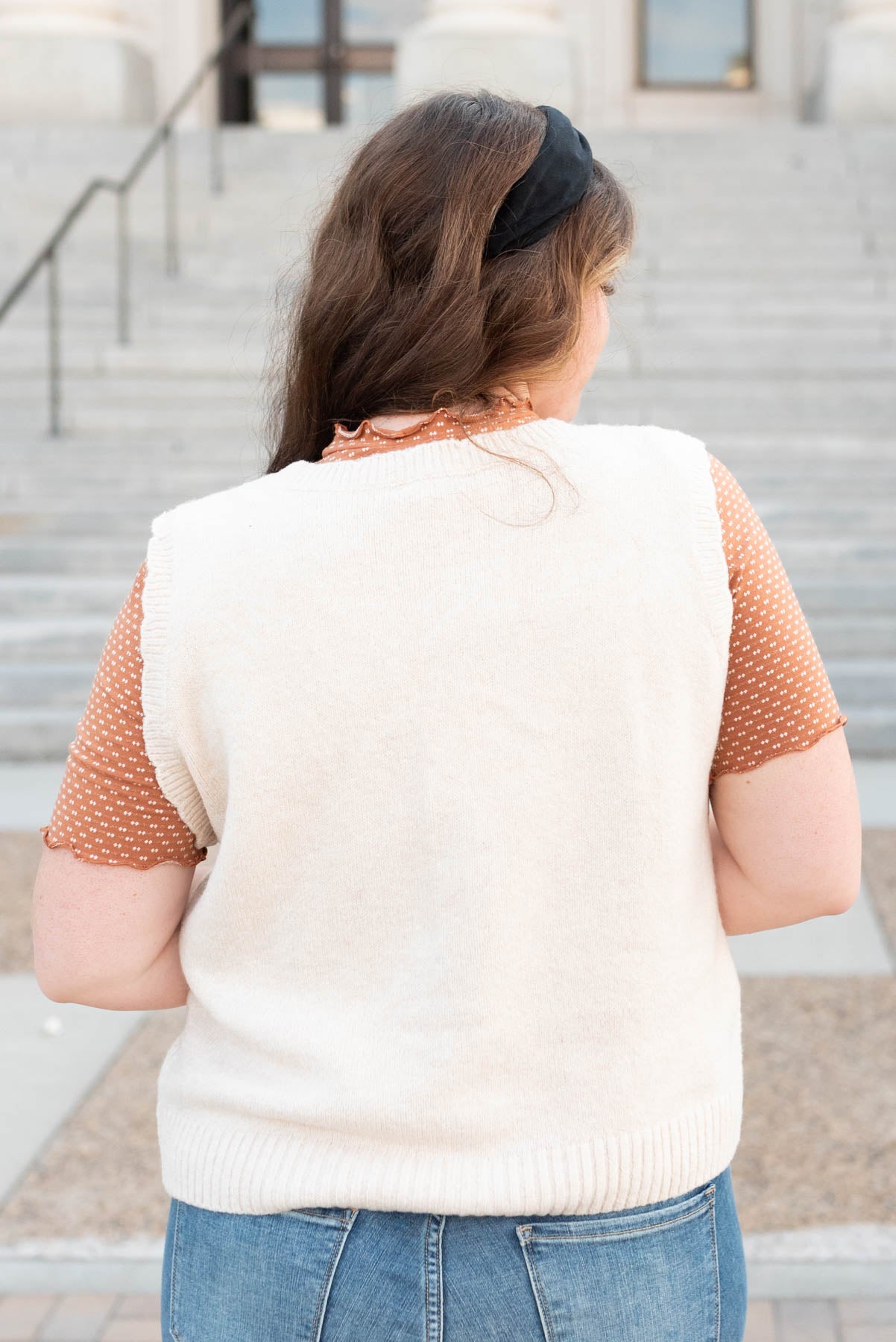 Back view of the cream floral knit vest