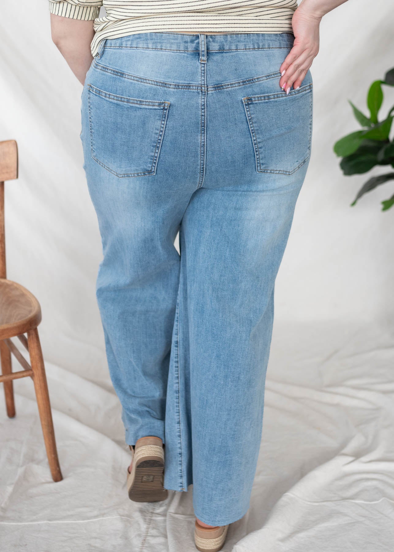 Back view of the plus size washed dneim pants