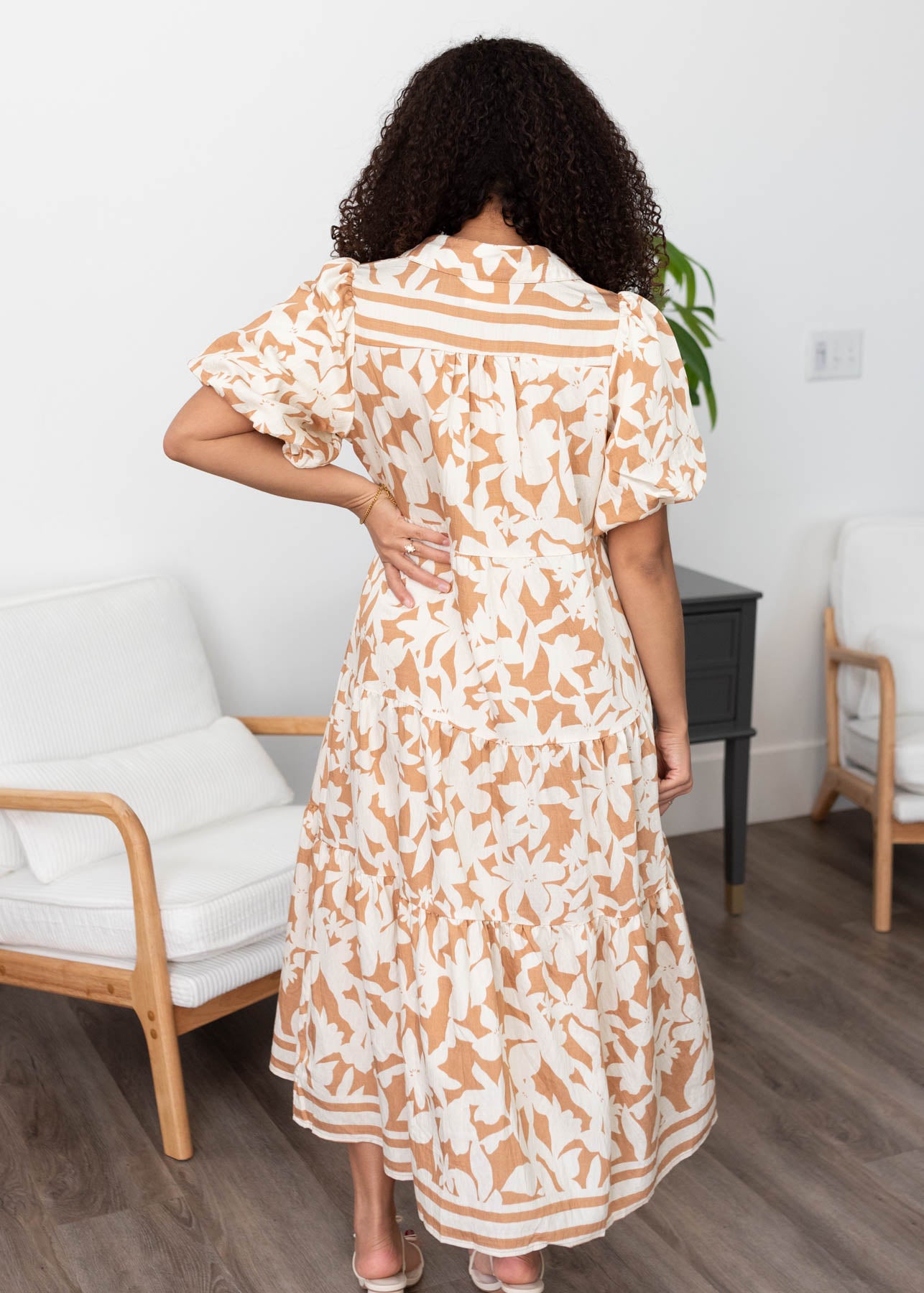 Back view of the taupe floral tiered dress