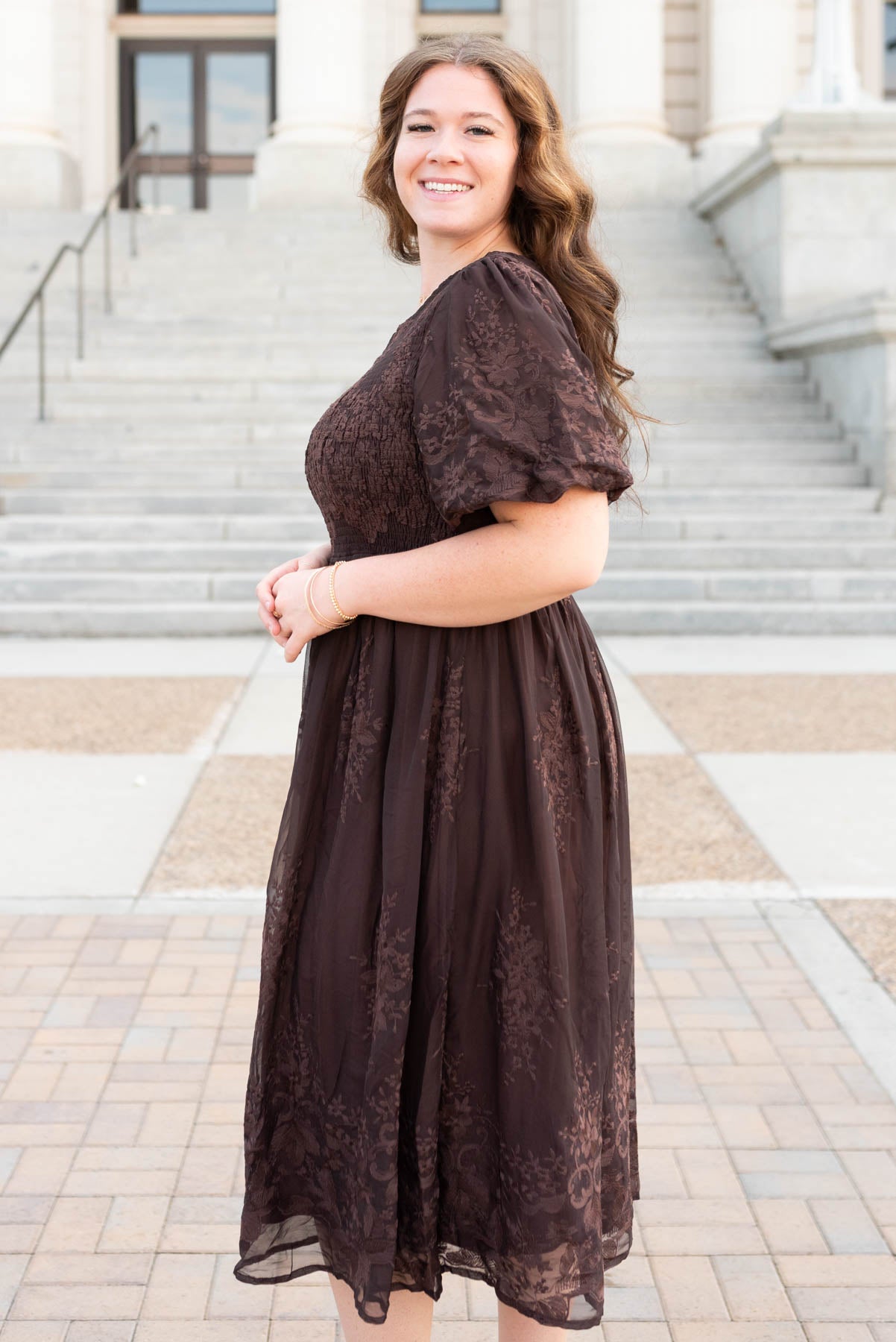 Side view of the plus size brown embroidered dress