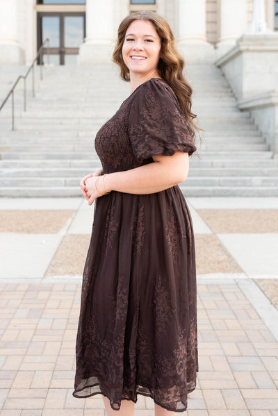 Side view of the plus size brown embroidered dress