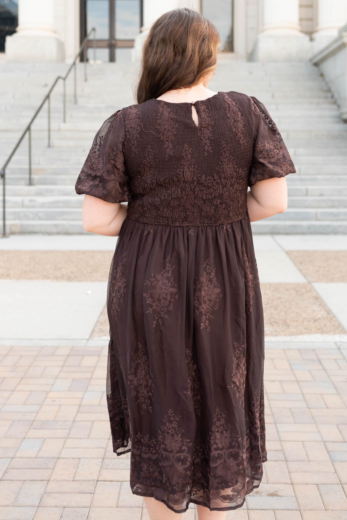 Back view of the brown embrodered dress in plus size