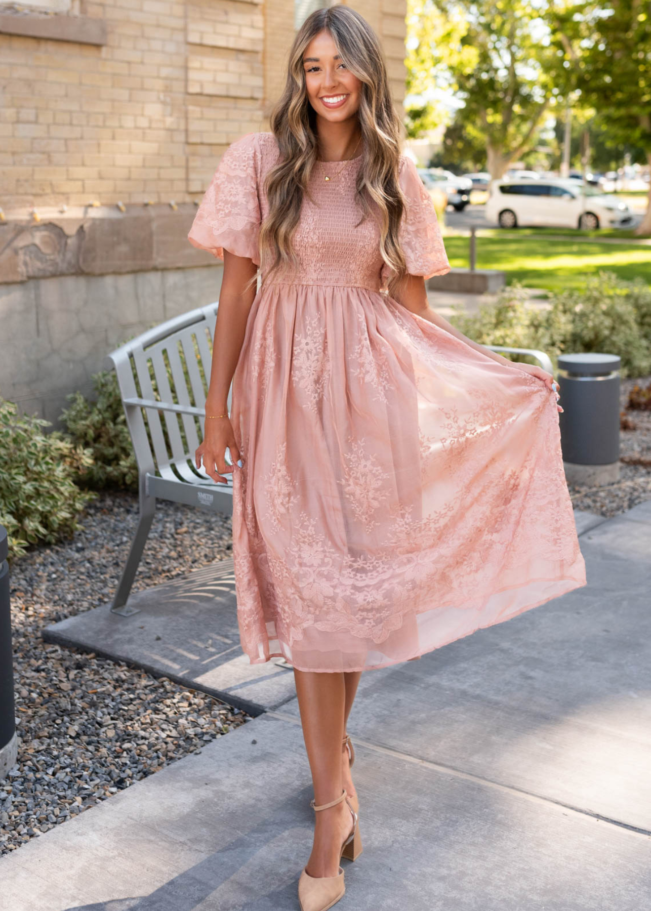 Dusty pink embroidered dress with short sleeves and smocked bodice