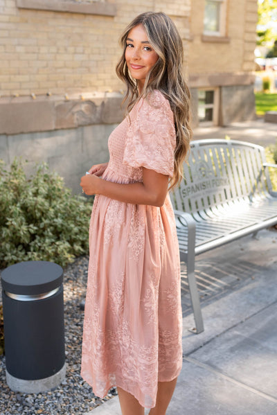 Side view of the dusty pink embroidered dress