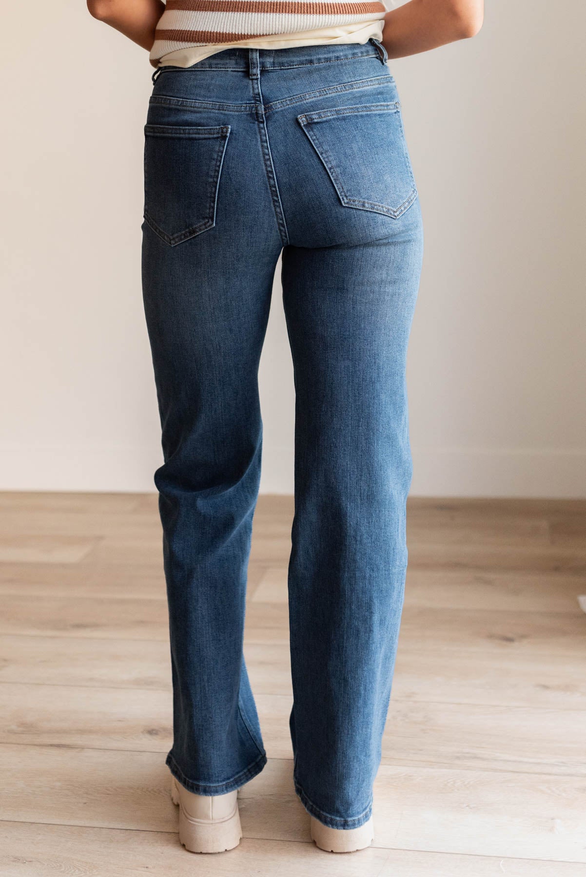 Back view of the medium wash high rise straight jeans