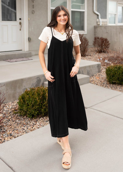 Black overall dress with thin adjustable straps