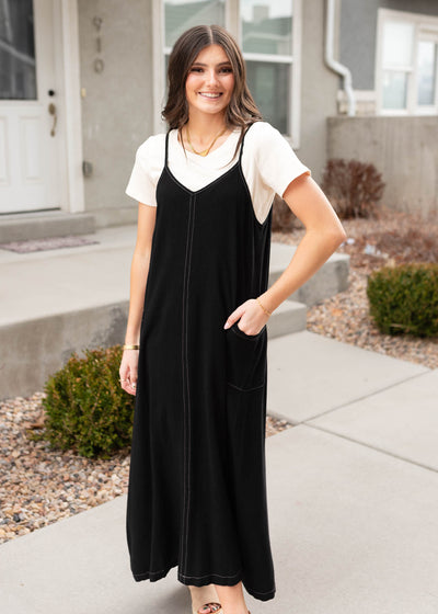 Black overall dress with side pockets