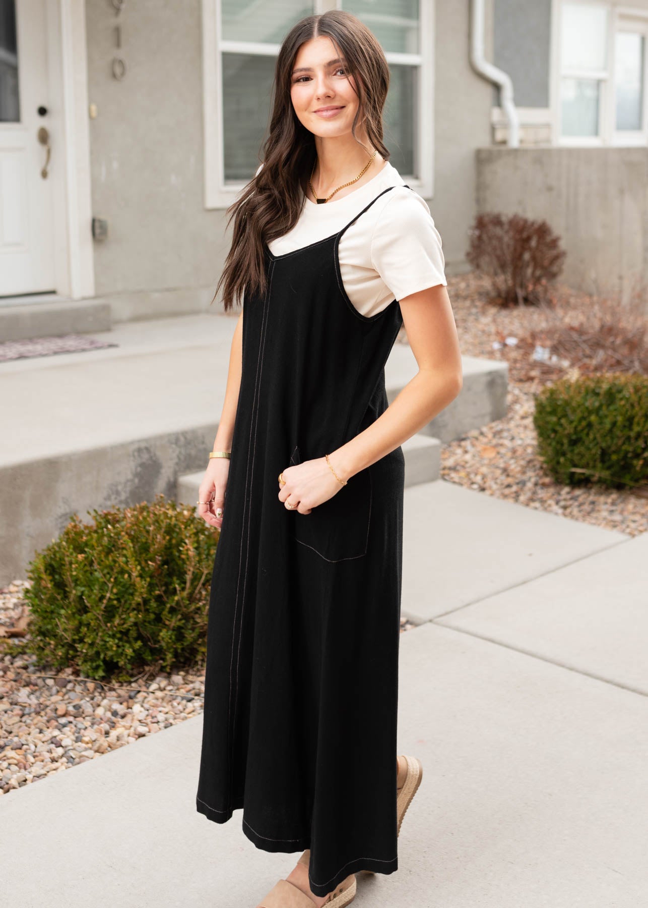 Side view of the black overall dress