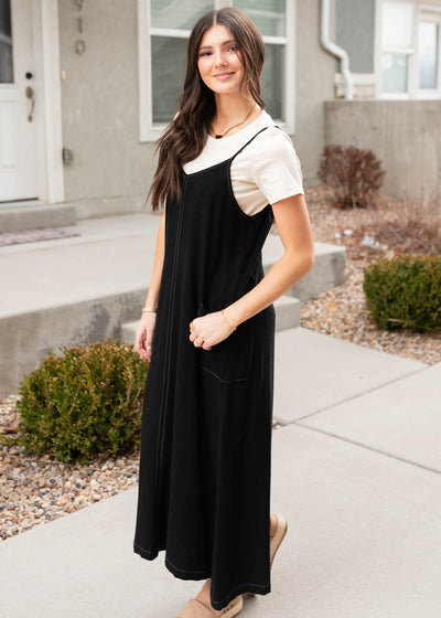 Side view of the black overall dress