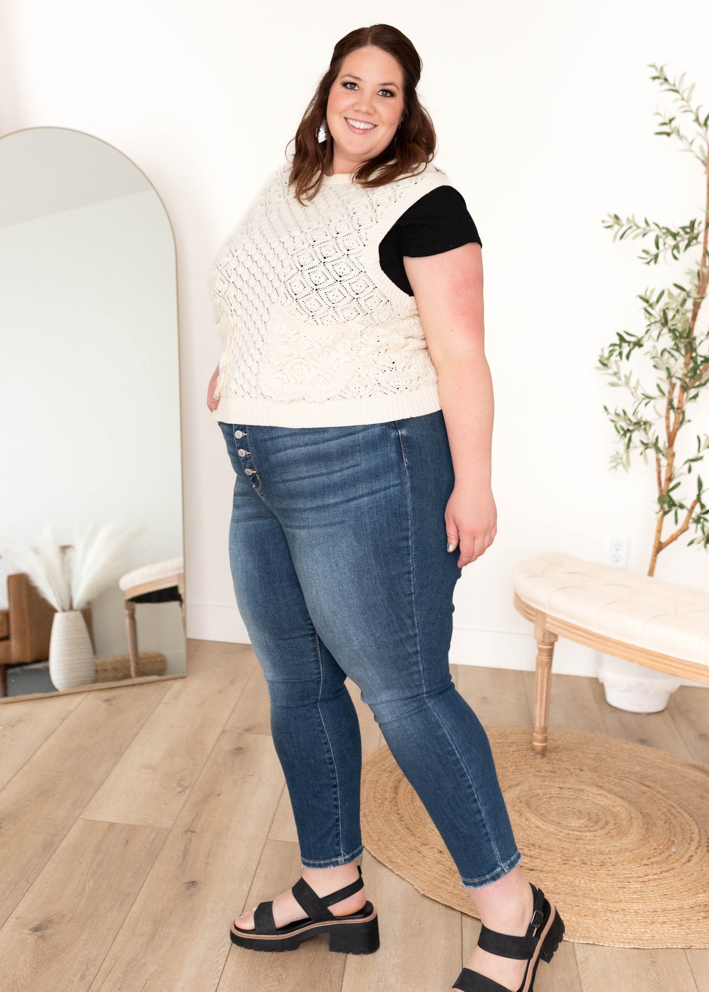 Plus size cream knit sweater with front ruffle edge pockets