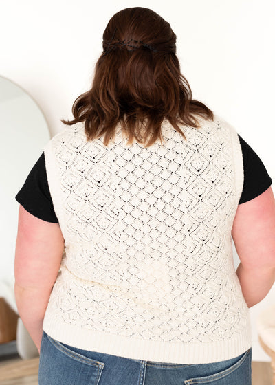 Back view of the cream knit sweater vest in plus size