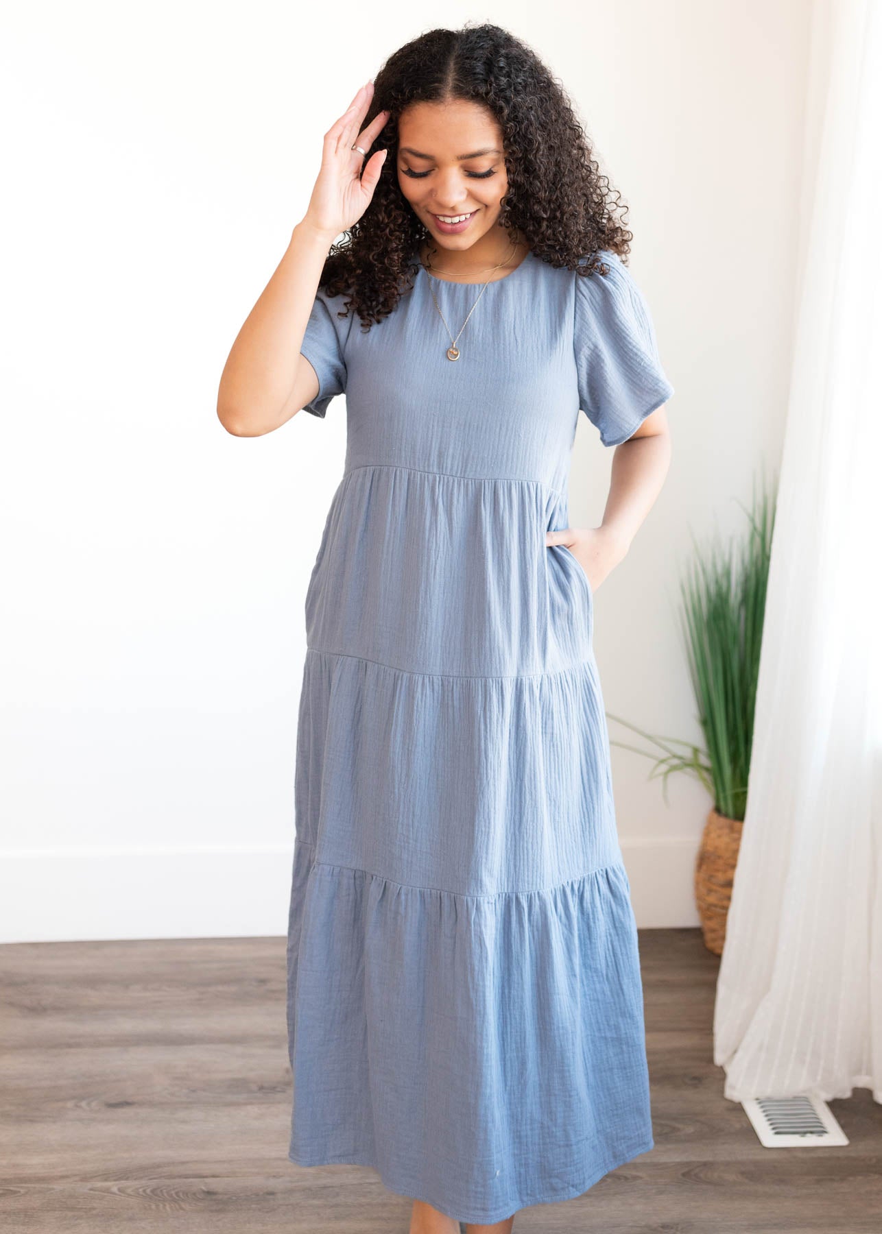 Blue gauze tiered dress with short sleeves and pockets