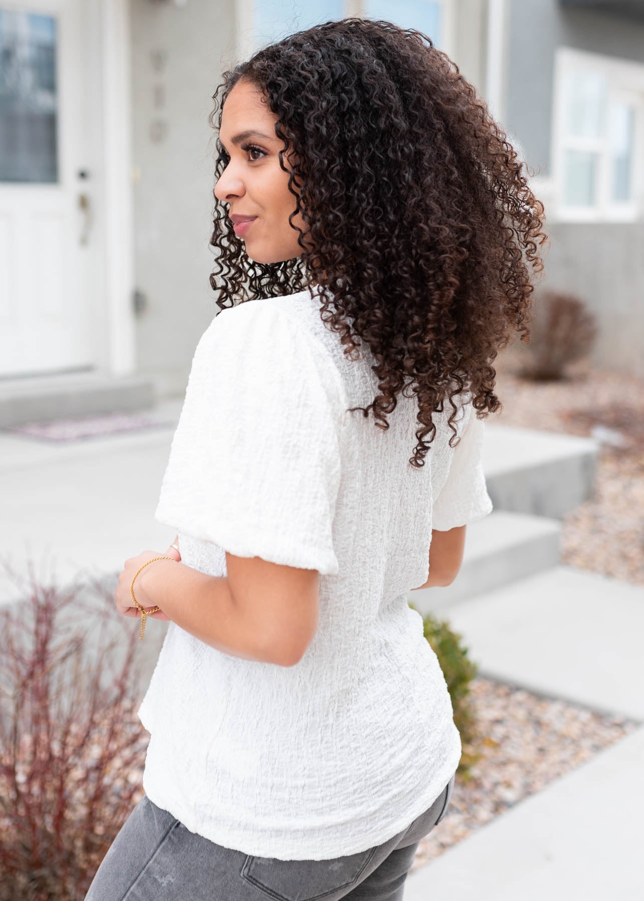 Side view of the ivory textured top