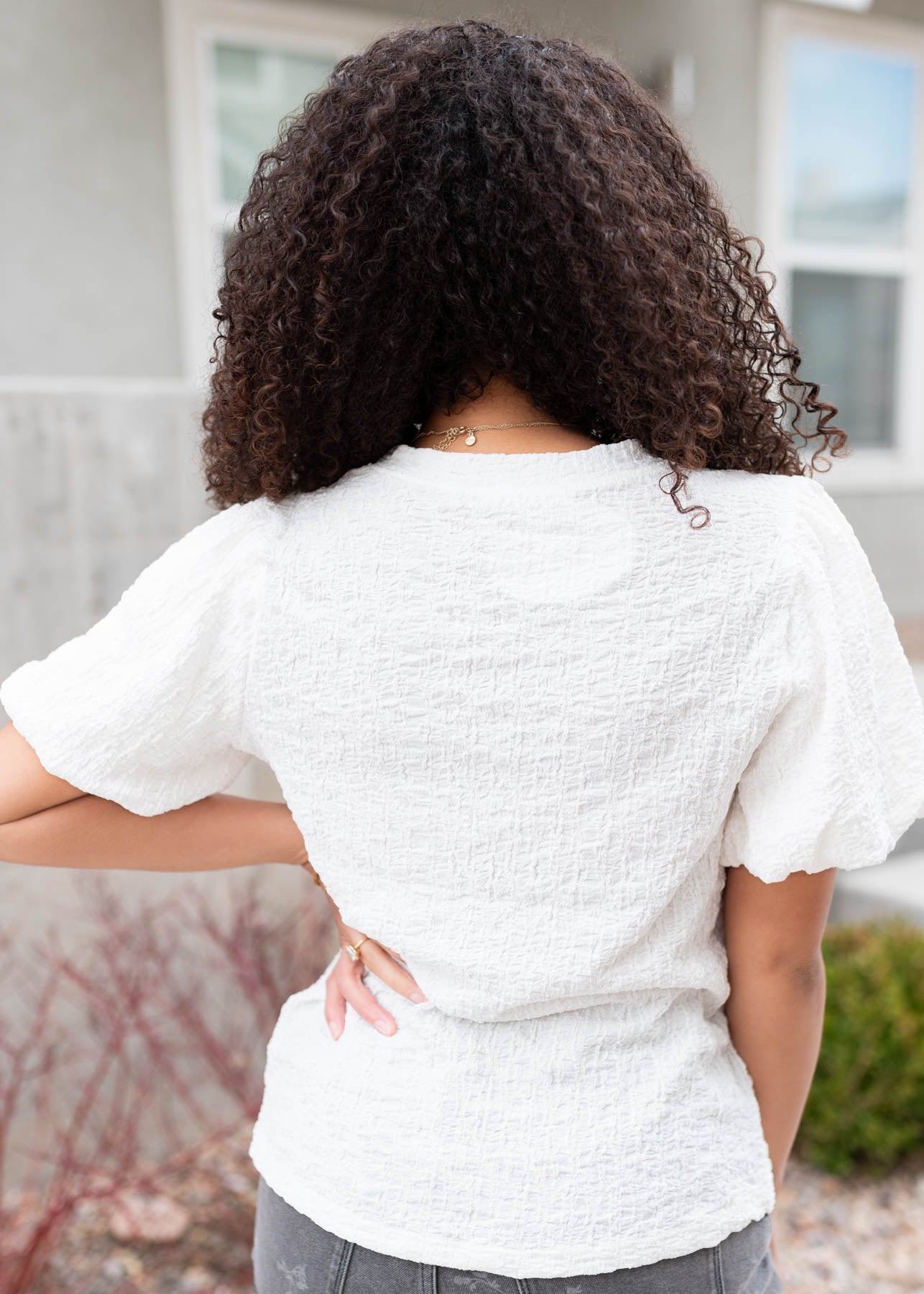 Back view of the ivory textured top