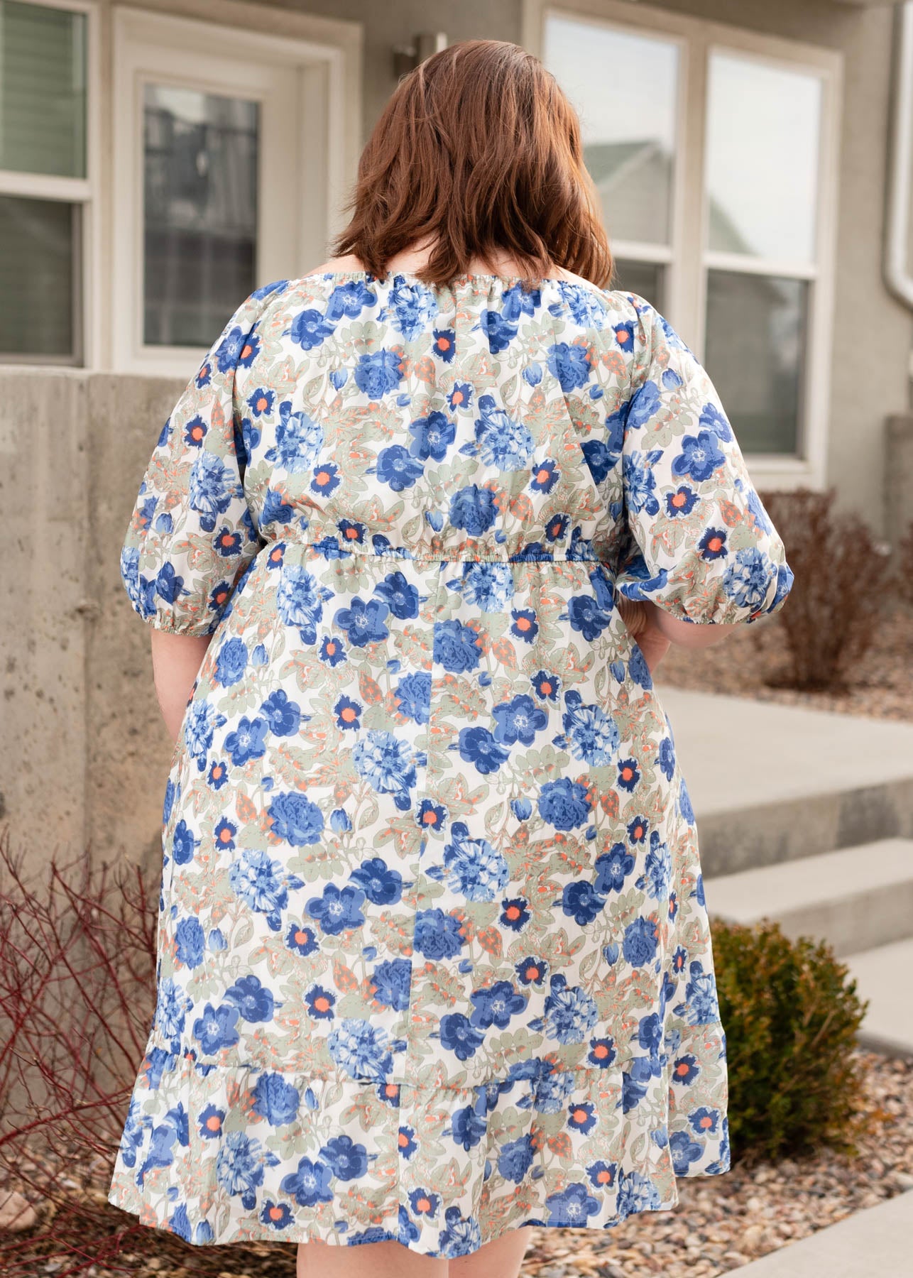 Back view of the blue flroal dress in plus size