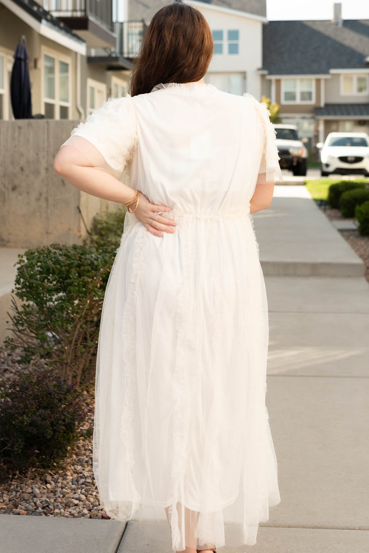 Back view of the plus size cream sheer ruffle dress