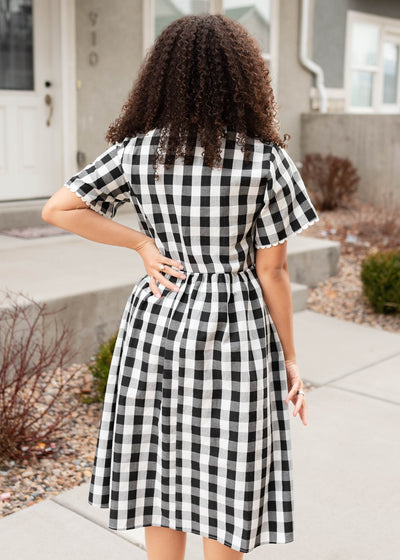 Back view of the black gingham button dress