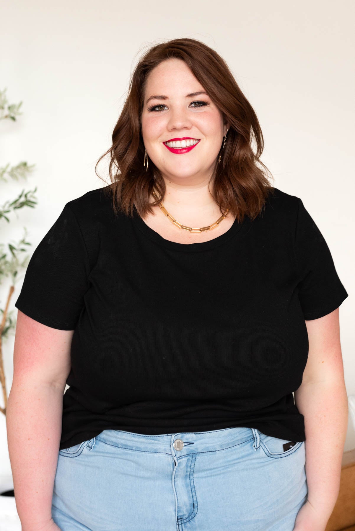 Plus size black ribbed top with short sleeves