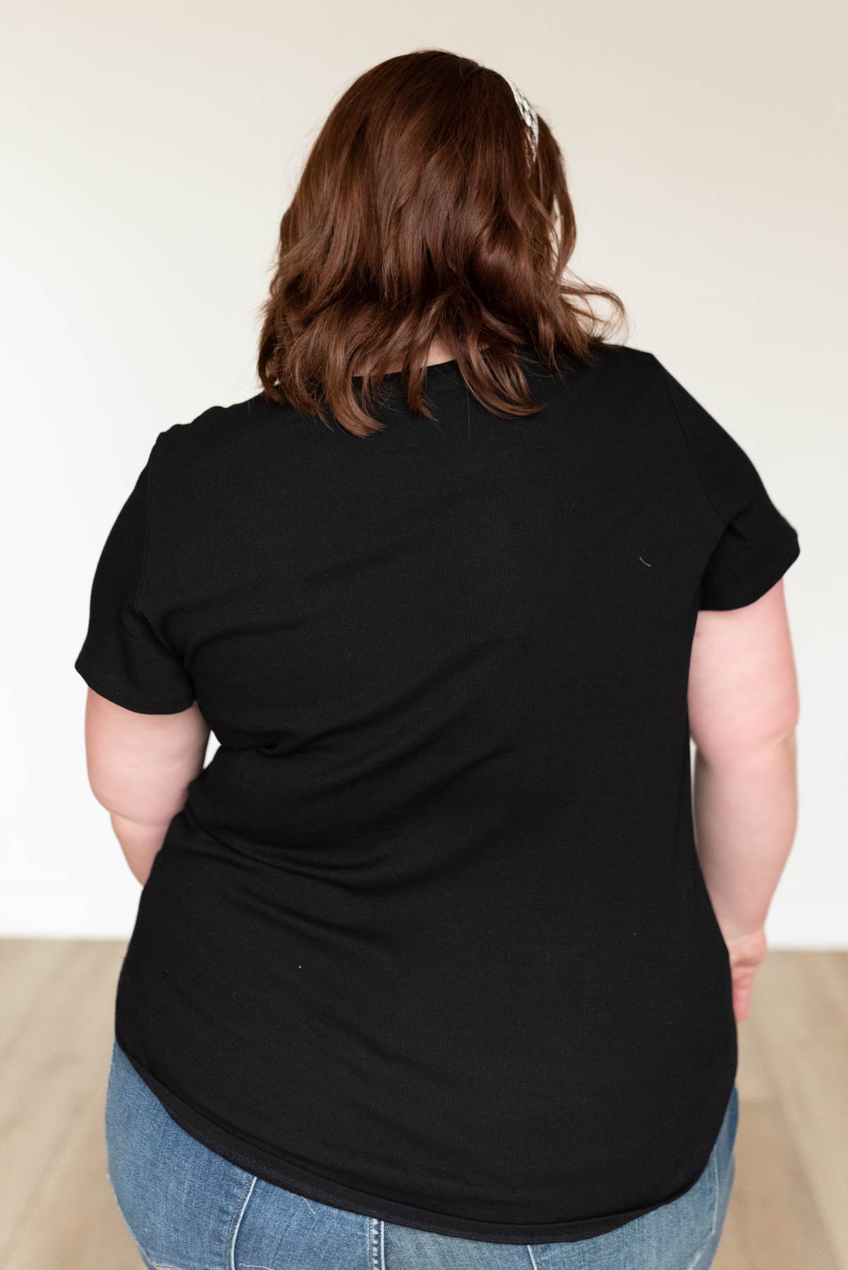 Back view of the plus size black ribbed top