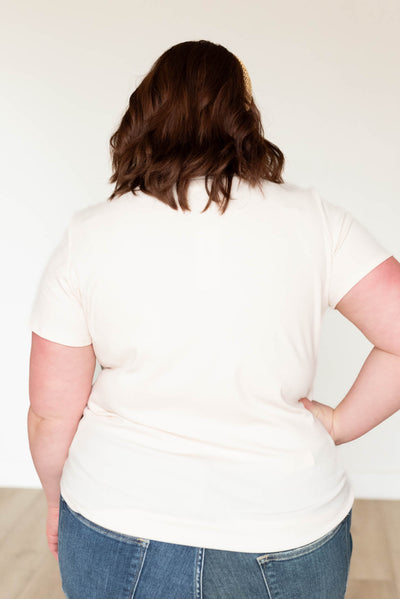 Back view of a plus size cream ribbed top