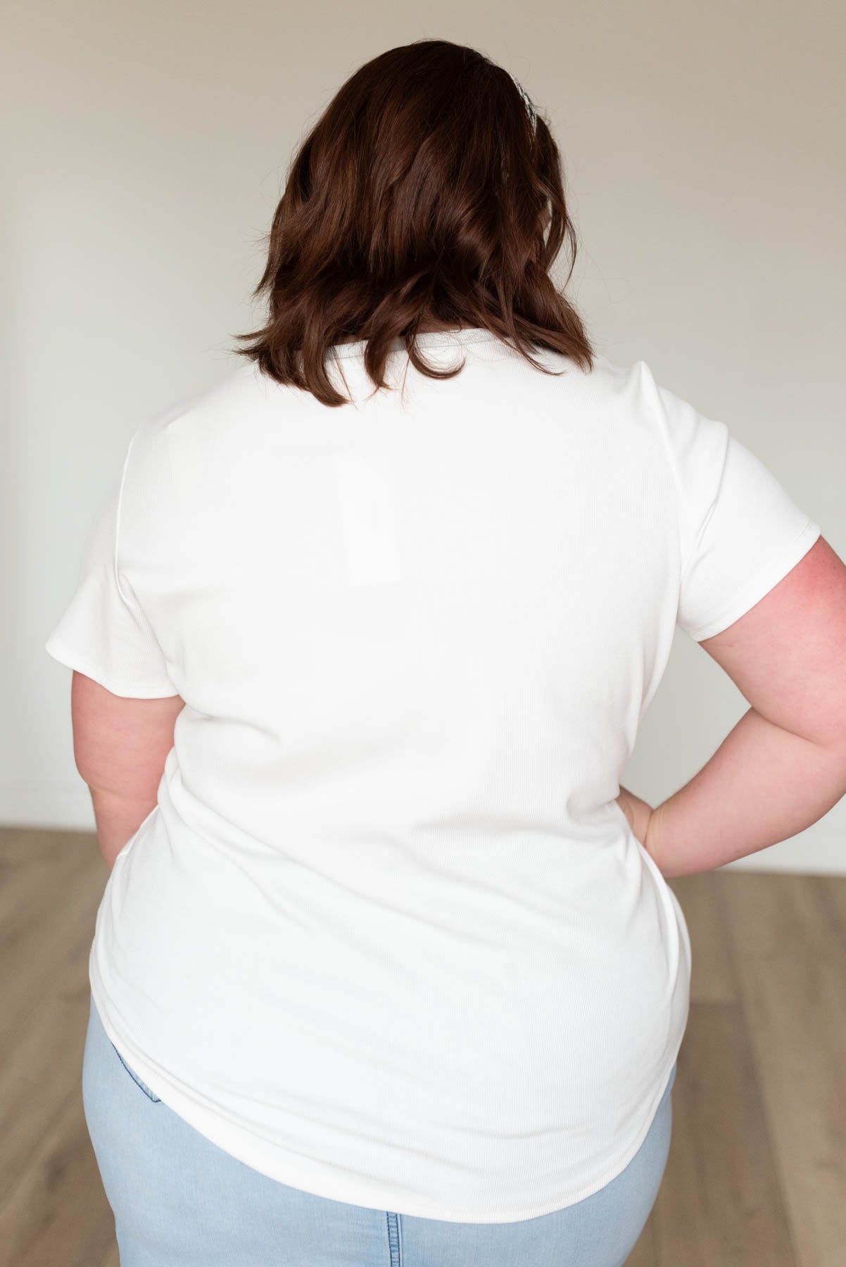 Back view of the plus size white ribbed top