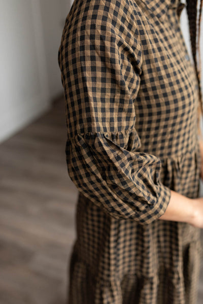 Close up of the sleeve on the brown gingham tiered dress