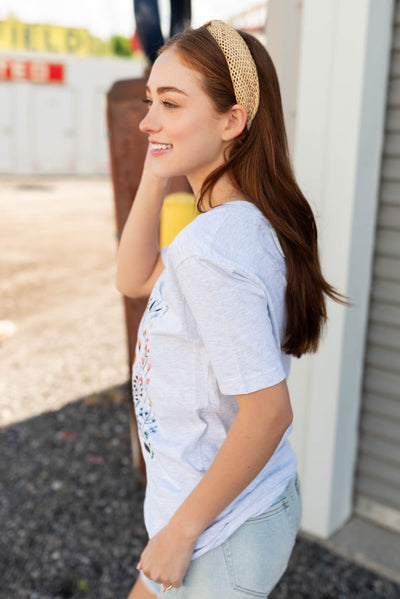 Side view of the multi color wildflower tee