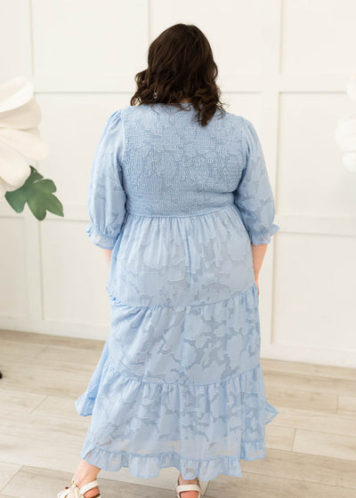 Back view of the blue floral tiered dress