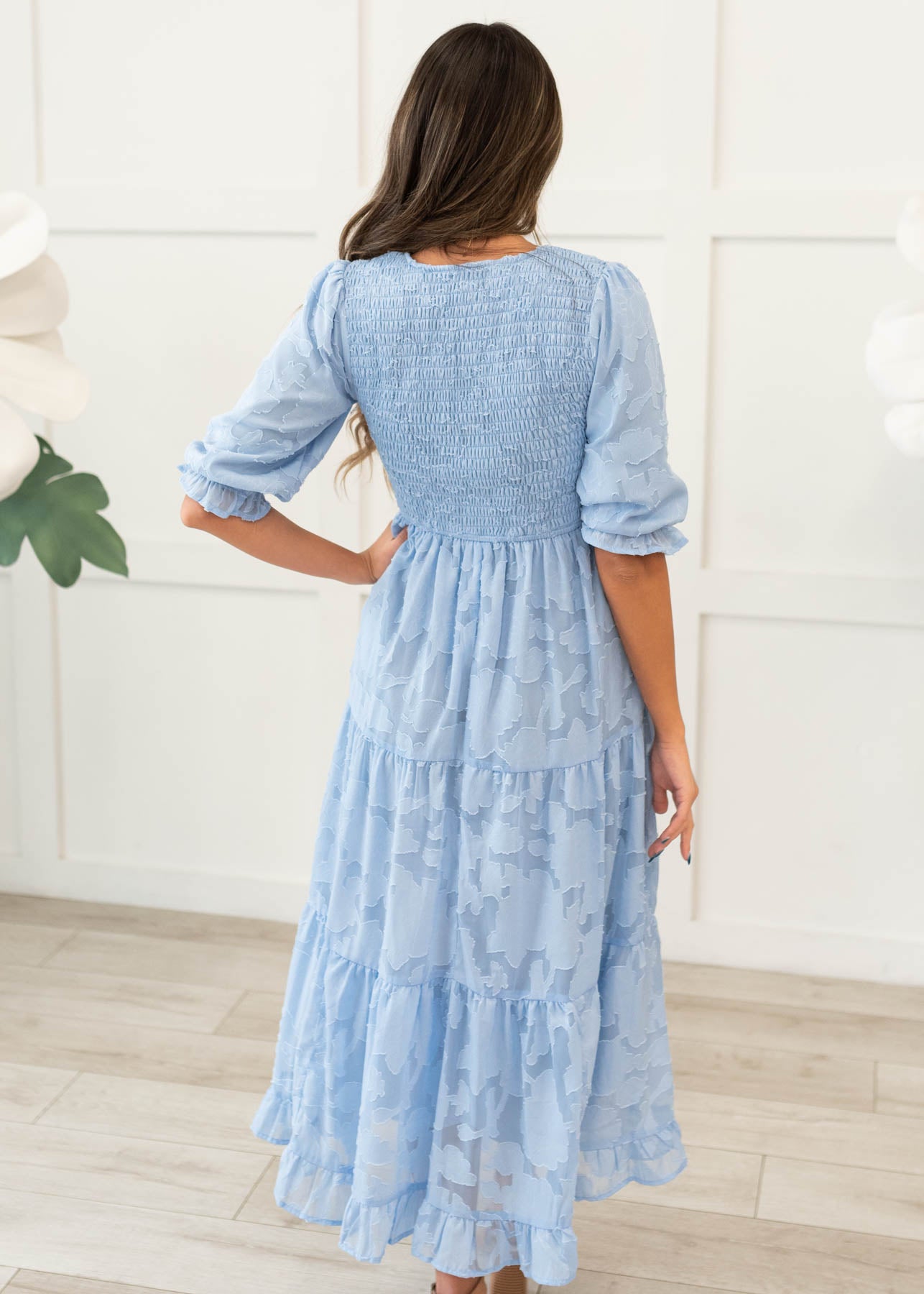 Back view of the blue floral tiered dress