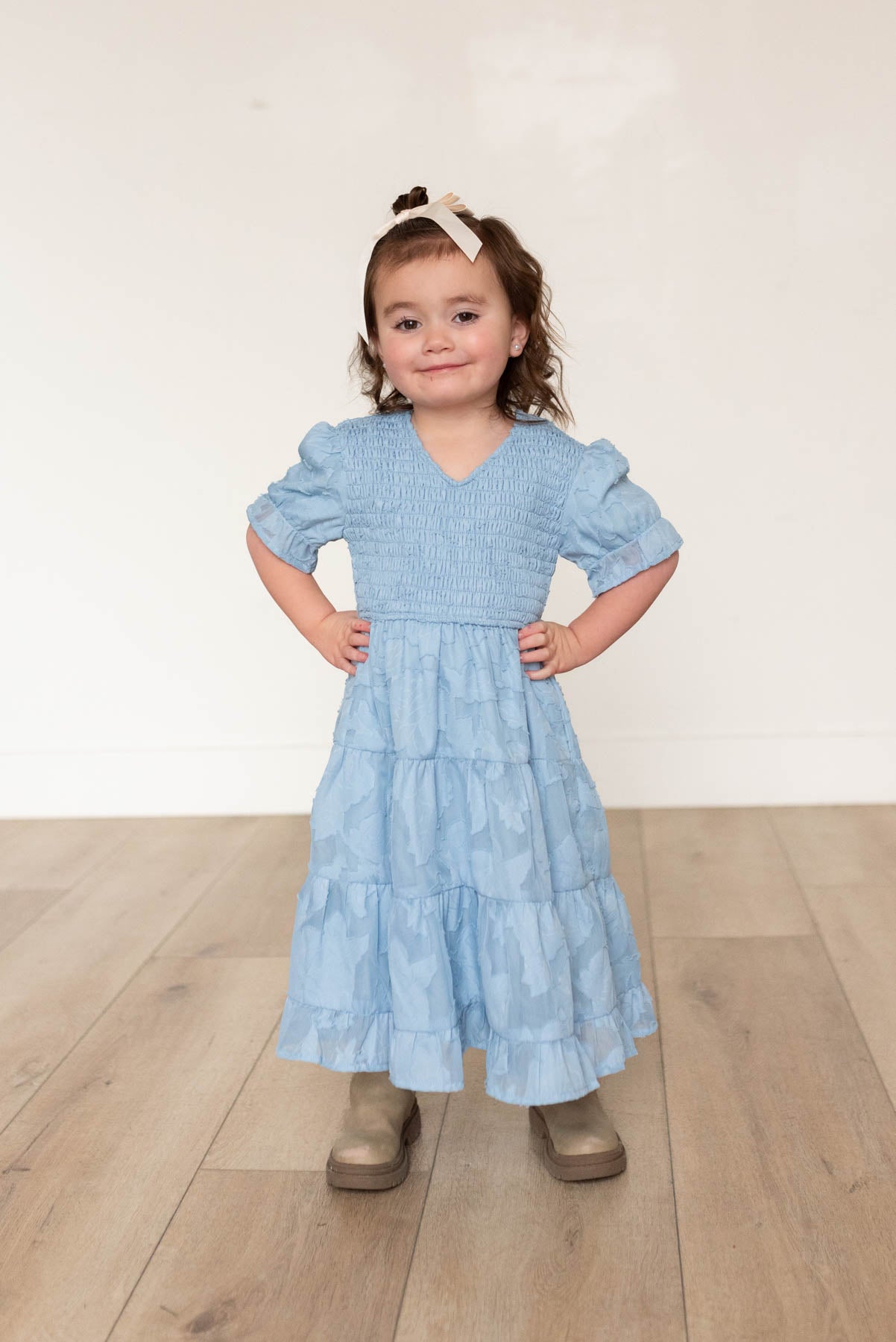 Blue floral tiered little girl dress with ruffle at the hem