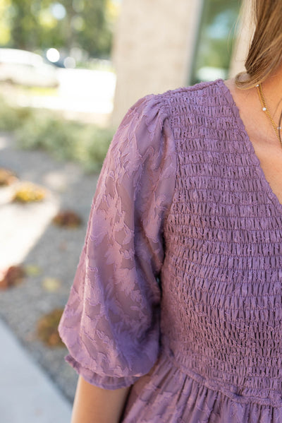 Close up of the fabric on the dusty lilac floral dress 