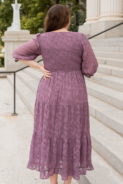 Back view of the purple floral ress in plus size