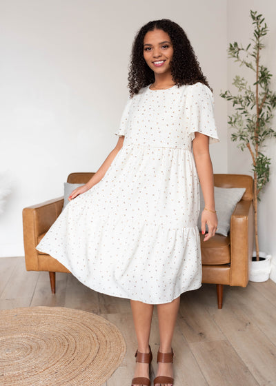 Below the knee ivory printed tiered dress