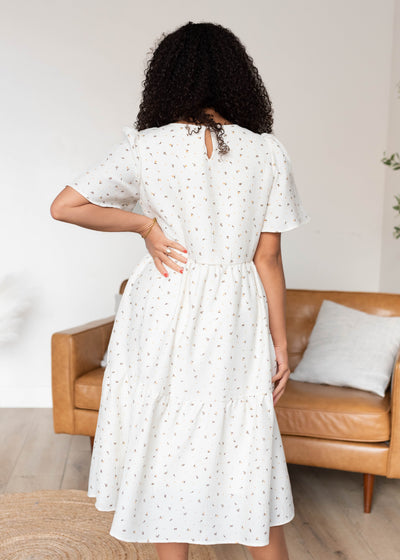 Back view of the ivory printed tiered dress