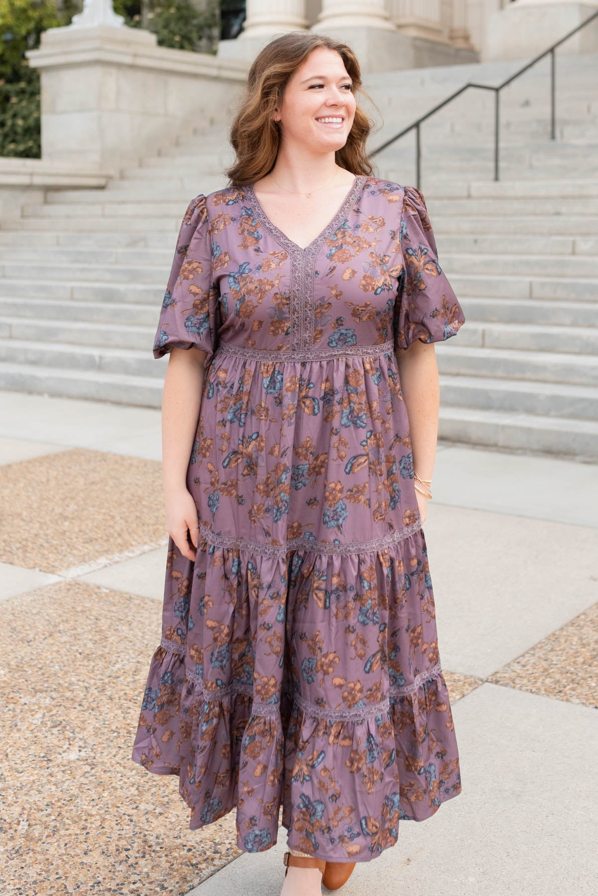 Purple floral tiered dress with a v-neck in plus size