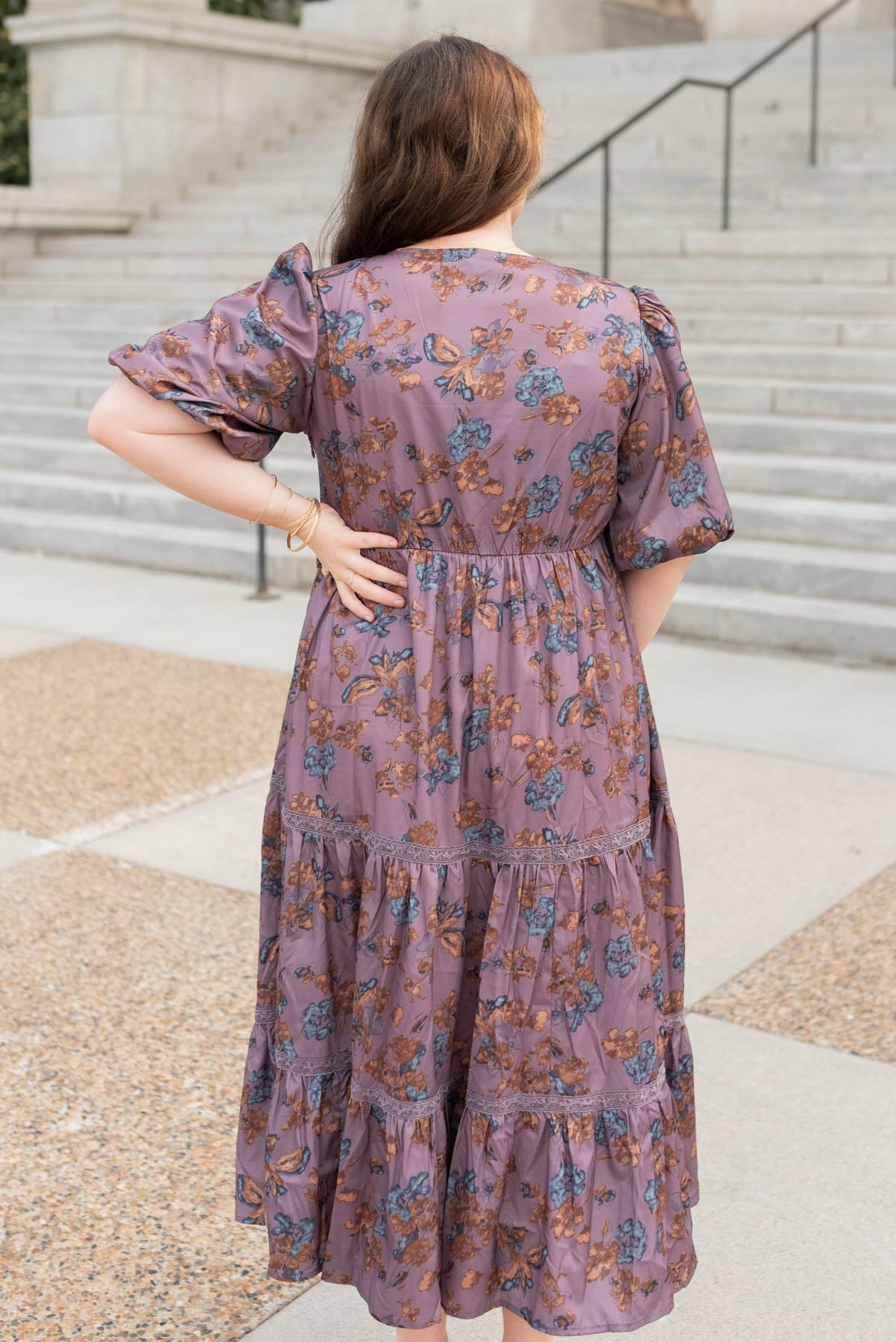 Back view of the plus size purple floral tiered dress