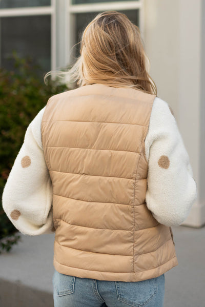 Back view of a khaki puff vest