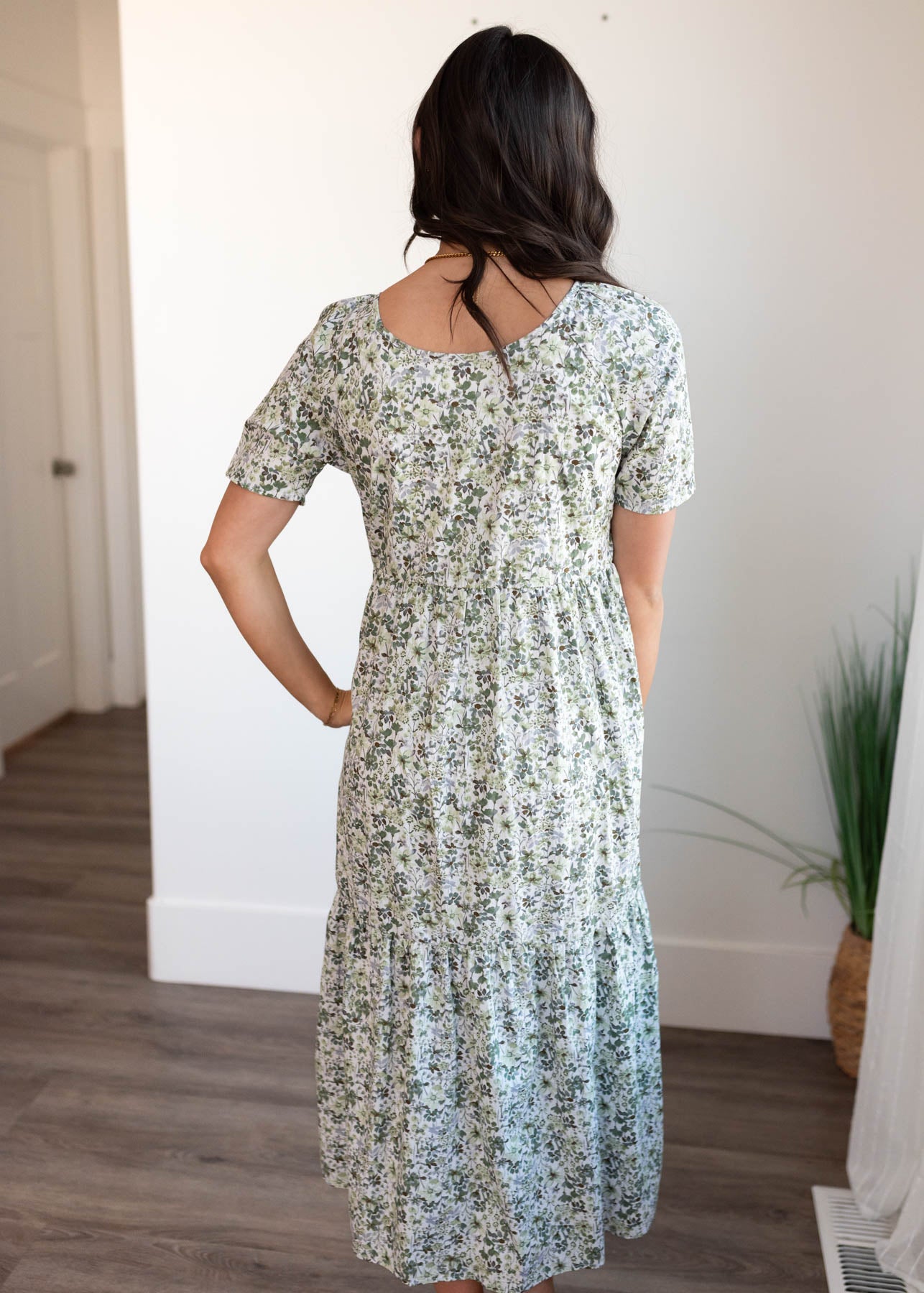 Back view of the green floral tiered dress