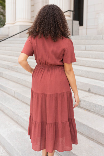 Back view of the terracotta tiered wrap dress