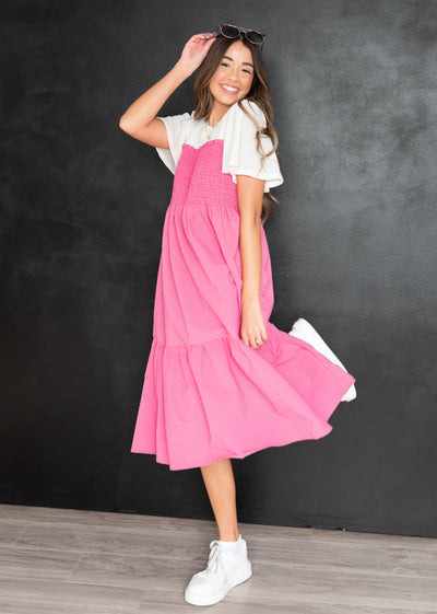 White shirt attached to the hot pink tiered dress