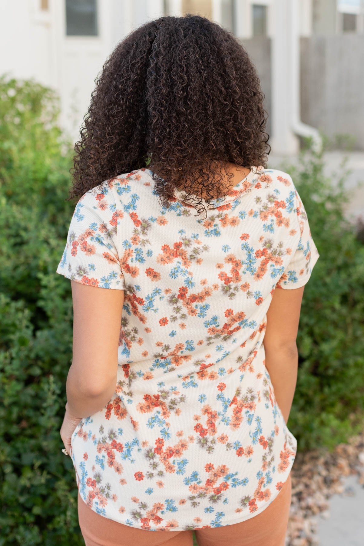 Back view of the cream floral top