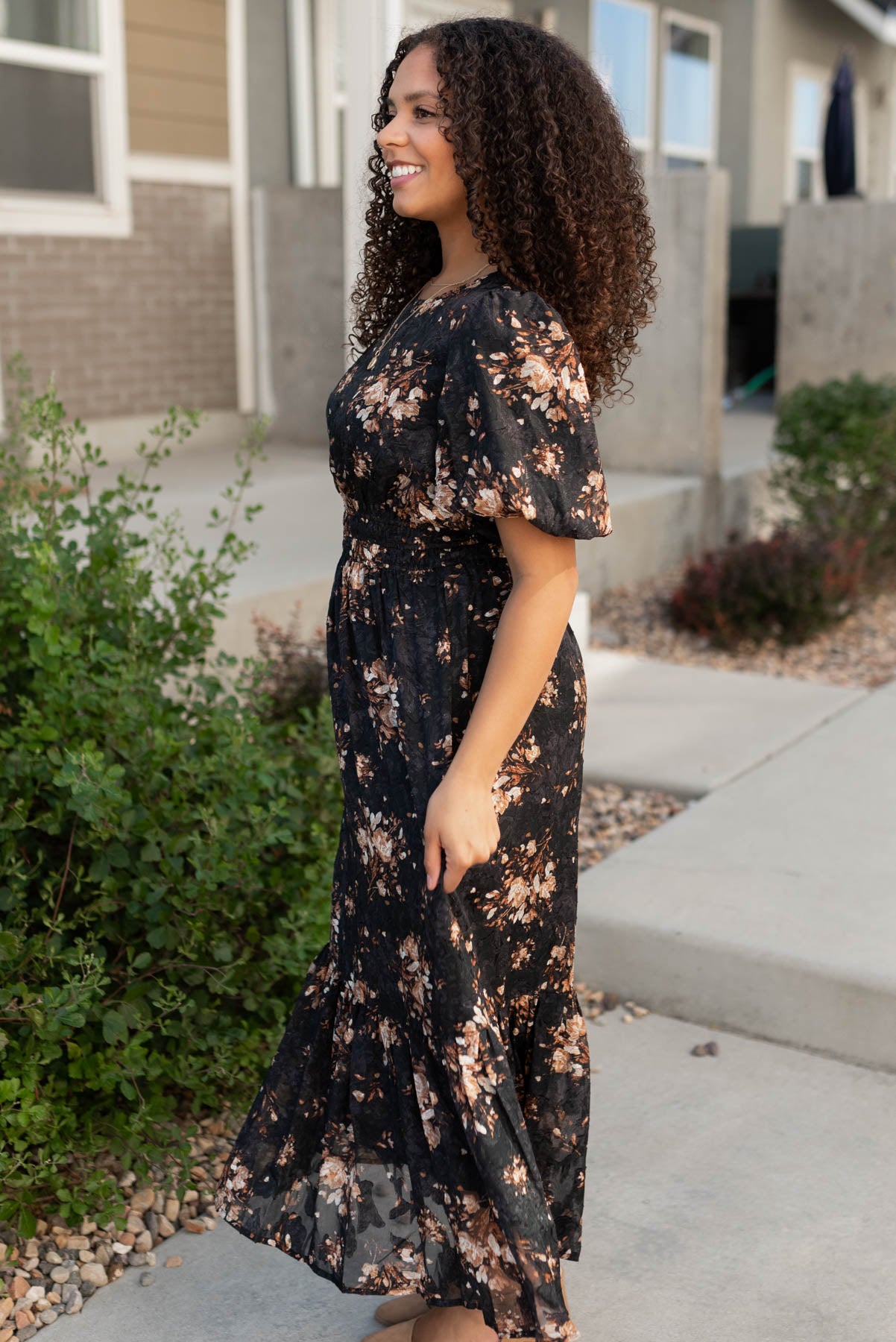 Side view of teh black floral dress