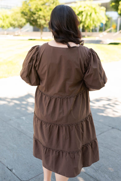 Back view of the plus size brown tiered dress