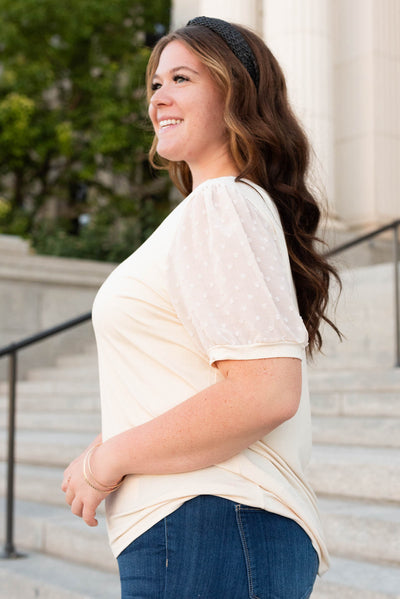 Side view of the eggshell dot puff sleeve top